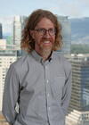 a man standing in front of a building